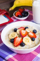 Healthy breakfast with oatmeal, fruits and milk with planning concept