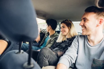 Group of friends multiethnic millennials view from automobile window traveling by car - togetherness, interaction, car sharing concept © Eugenio Marongiu