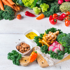 Healthy vegan buddha bowl with kale leaves and raw vegetables