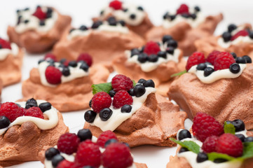 Pavlova dessert with raspberries and blueberries