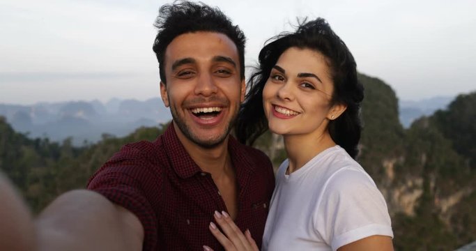 Couple On Mountain Top Taking Selfie Photo, Hispanic Man And Woman Happy Smiling Slow Motion 60