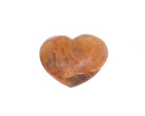 Golden healer quartz heart isolated on white background