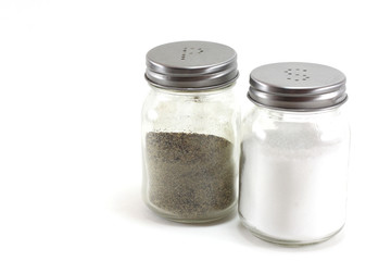 Pepper and salt shakers on a white isolated background