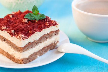 Dessert tiramisu decorated with mint