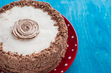 chocolate cake with whipped cream on the red plate