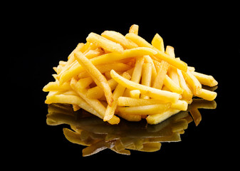 Pile of french fries over black