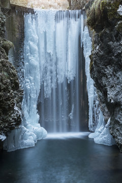 Italy, trentino south Tyrol, Non Valley, Waterfall from Smeraldo lake in winter.
