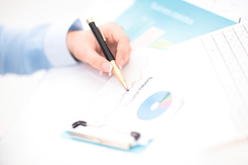 Woman hand signing a contract