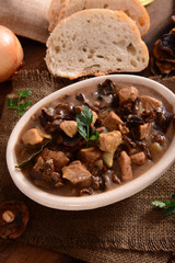 Stew with meat, mushrooms and vegetables