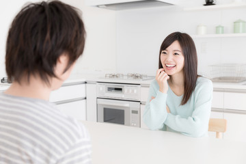 young asian couple relaxing in kitchen