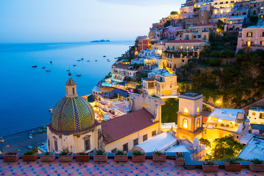 View of town at seaside during sunset