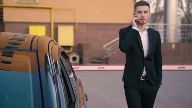 Young businessman become worried after having a phone call 4K