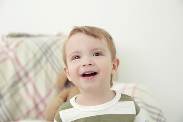 Portrait of cute little boy on blurred background