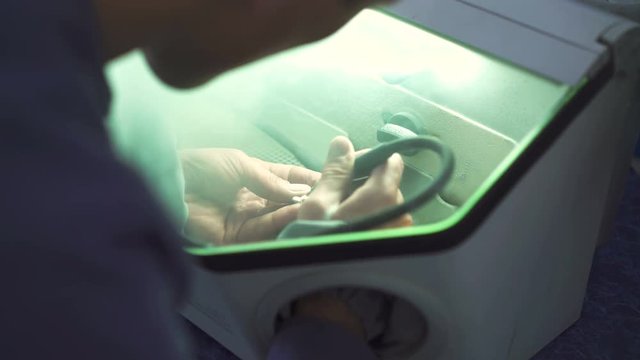 Close up of a dental technician making partial ceramic crown in dental lab 4K