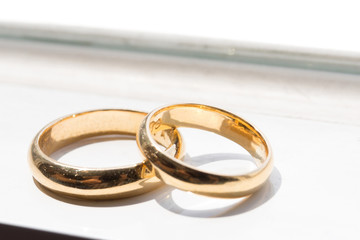 set of gold wedding rings on a white background