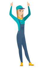 Mechanic standing with raised arms up.