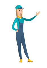 Caucasian mechanic showing a direction.