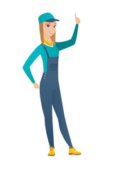 Caucasian mechanic pointing with her forefinger