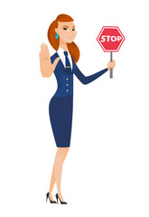 Caucasian stewardess holding stop road sign.