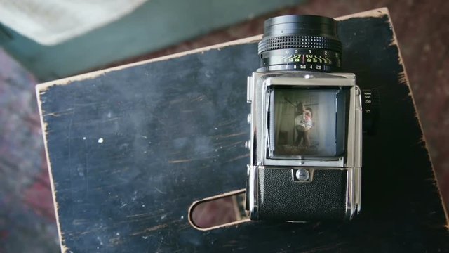 View On Video Recorder Of Old Moving-film Camera Of Happy Multiethnic Couple Dancing On The Bed In Pajamas.