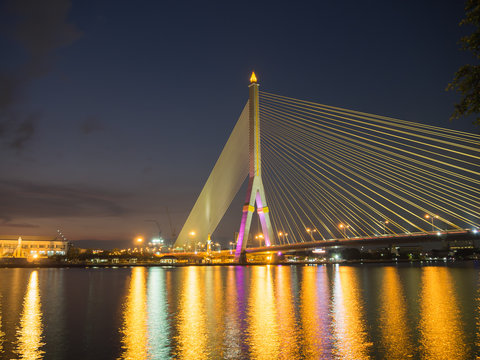 Rama VIII Bridge at night on the river in thailand © roongrote