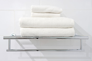 white bath towels on towel rack