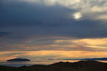 Small island on sunrise background