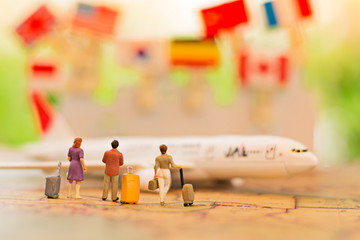 miniature people, travel by plane for travel. using as business background concept.