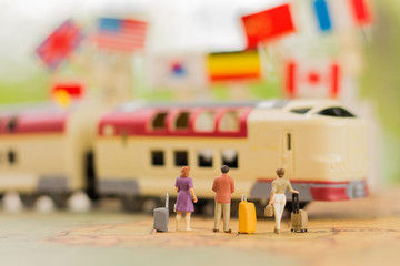 miniature people, travel by train for travel. using as business background concept.