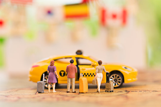 Miniature People, Waiting Taxi For Travel. Using As Business Background Concept.