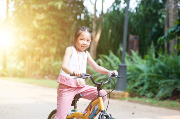 Fototapeta na wymiar Child riding bicycle outdoor.