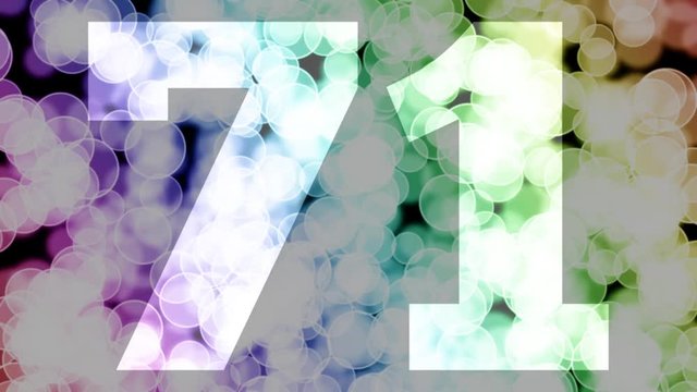 Seventy one to seventy two years birthday fade in/out animation with color gradient moving bokeh background. Animation: 90 frames still with number, 180 fade out, 30 clear, 180 fade in, 300 still.

