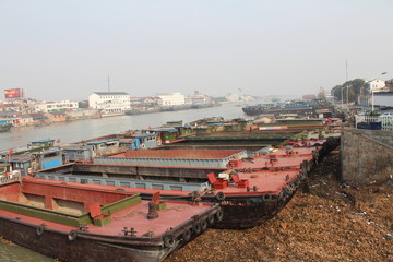 Fototapeta na wymiar Barges Along a Huge Canal in Jiangsu Province China