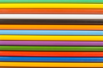 Several wooden colored pencils in a row for background