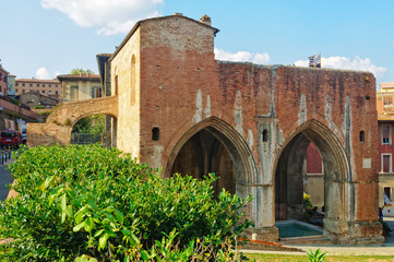 Fototapeta na wymiar Arches of the Fonte Nuova in Siena, Italy