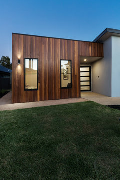 Vertical contemporary new home with wood cladding detail