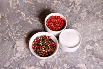 assortment of pepper and salt in bowls, closeup, horizontal