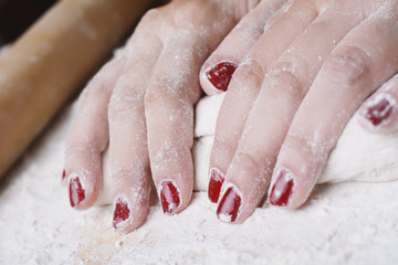 Fototapeta premium Woman hands kneading dough.