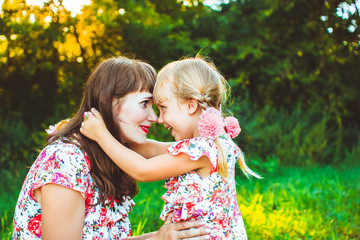 little girl on nature with the mother