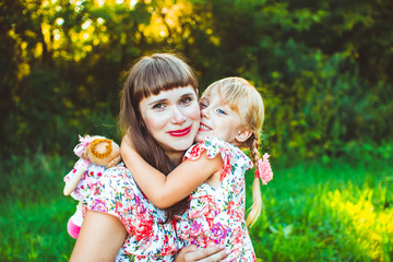 Obraz premium little girl on nature with the mother