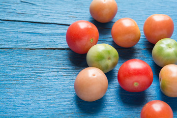 Fresh tomatoes on wood color