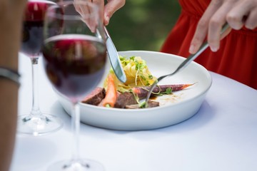 Woman having lunch at outdoor restaurant