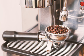 Roasted coffee bean in  a portafilter prepare for making coffee from espresso machine