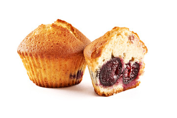 Tasty muffins with cherry isolated on white background