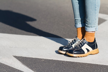 close up of woman shoes standing on the street