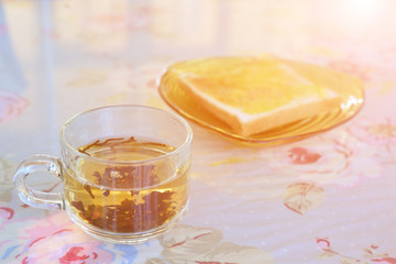 Morning tea with bread on the table.