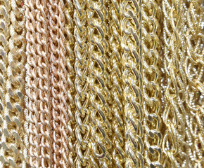 background of golden necklaces and chains