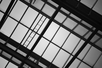 Glass wall or ceiling of building, black and white toned for abstract background.