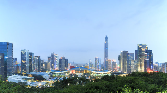 Shenzhen cityscape at dusk with the Civic Center and the Ping An IFC on foreground, China