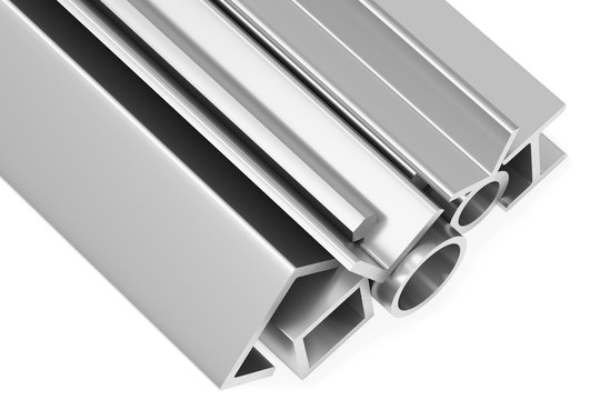 Shiny rolled steel metal products on white closeup